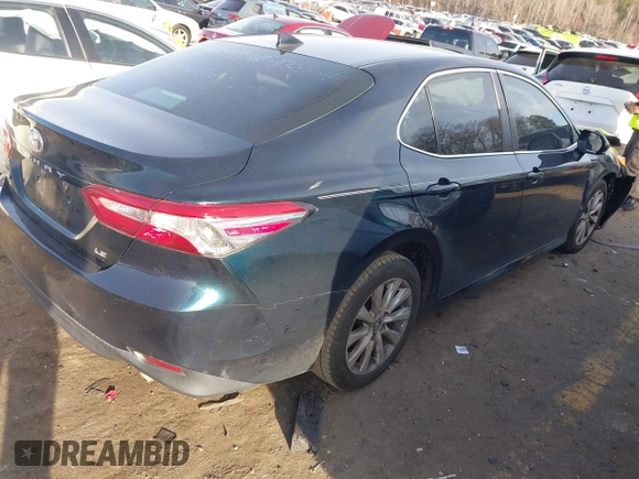2020 Toyota Camry LE with VIN 4T1C11AK0LU864863, listed as a IAAI auction lot 41748371 with 82,063 mi miles and . Bid and sale history available at carsss.com. Image 4.