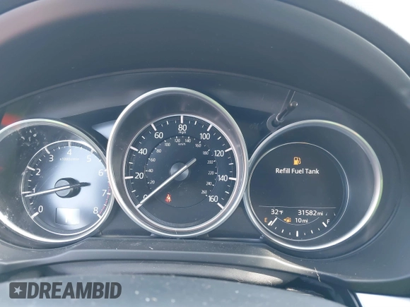 2020 Mazda CX-5 Touring z VIN JM3KFBCMXL1741182, wystawiony jako IAAI lot #41602315 z przebiegiem 31 582 mil mil oraz . Historia ofert i sprzedaży dostępna na DreamBid. Obrazek 7.
