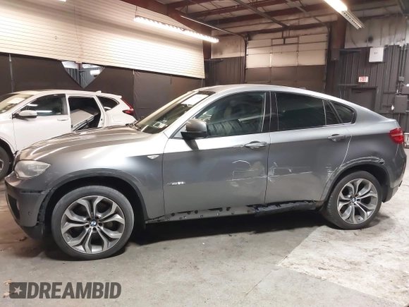 2014 BMW X6 50i z VIN 5UXFG8C55EL592995, wystawiony jako IAAI lot #41724960 z przebiegiem 137 112 mil mil oraz . Historia ofert i sprzedaży dostępna na DreamBid. Obrazek 6.