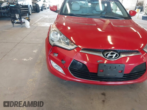 2012 Hyundai Veloster w/Gray Int z VIN KMHTC6AD3CU023998, wystawiony jako IAAI lot #42186875 z przebiegiem 170 771 mil mil oraz . Historia ofert i sprzedaży dostępna na DreamBid. Obrazek 6.