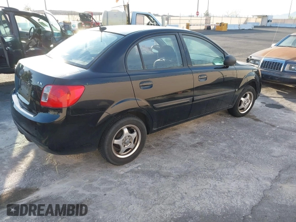 2010 Kia Rio LX with VIN KNADH4A33A6668719, listed as a IAAI auction lot 41777544 with 124,400 mi miles. Bid and sale history available at carsss.com. Image 4.