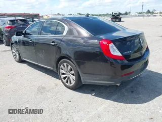 2014 Lincoln MKS with VIN 1LNHL9EK0EG608300, listed as a IAAI auction lot 41900902 with 144,253 mi miles. Bid and sale history available at carsss.com. Image 3.