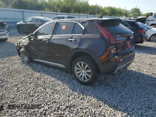 2021 Cadillac XT4 FWD Premium Luxury z VIN 1GYFZCR45MF002654, wystawiony jako Copart lot #52288105 z przebiegiem Nie podano mil oraz Szkody całkowita. Historia ofert i sprzedaży dostępna na DreamBid. Obrazek 2.