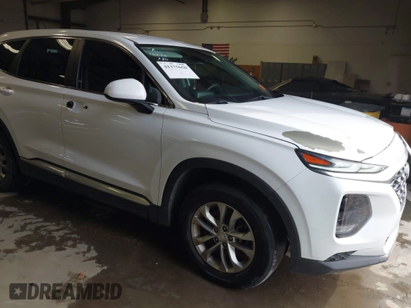 2019 Hyundai Santa Fe SE with VIN 5NMS23AD1KH063472, listed as a IAAI auction lot 41375650 with 64,496 mi miles and . Bid and sale history available at DreamBid. Image 1.