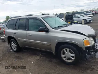 2003 GMC Envoy SLE with VIN 1GKDT13S932108979, listed as a IAAI auction lot 41938118 with 1 mi miles. Bid and sale history available at carsss.com. Image 13.