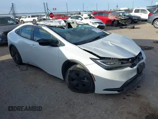 2024 Toyota Prius LE z VIN JTDACAAUXR3030783, wystawiony jako IAAI lot #41774976 z przebiegiem 20 000 mil mil oraz . Historia ofert i sprzedaży dostępna na DreamBid. Obrazek 1.