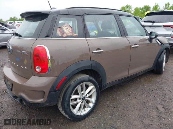 2014 MINI Countryman S with VIN WMWZC5C54EWM17898, listed as a IAAI auction lot 42343469 with 112,773 mi miles and . Bid and sale history available at DreamBid. Image 4.