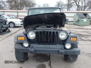 2004 Jeep Wrangler Sport with VIN 1J4FA49S64P794559, listed as a IAAI auction lot 41644201 with 107,445 mi miles. Bid and sale history available at carsss.com. Image 13.