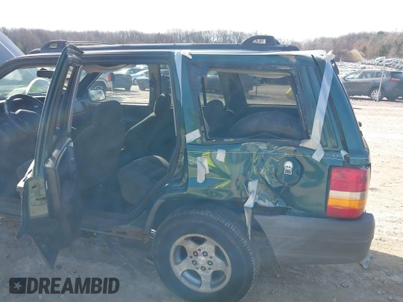 1997 Jeep Grand Cherokee Laredo with VIN 1J4GZ58S2VC595442, listed as a IAAI auction lot 41772133 with 229,764 mi miles. Bid and sale history available at carsss.com. Image 6.