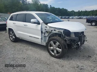 2017 Jeep Grand Cherokee Overland with VIN 1C4RJFCT7HC734125, listed as a Copart auction lot 54333215 with 101,229 mi miles and Salvage title. Bid and sale history available at DreamBid. Image 4.