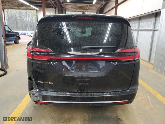 2023 Chrysler Pacifica Touring L with VIN 2C4RC1BG3PR582271, listed as a Copart auction lot 51644595 with 57,930 mi miles and Salvage Title. Bid and sale history available at carsss.com. Image 6.