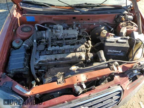 2001 Suzuki Esteem GL z VIN JS2GB41S915202412, wystawiony jako Copart lot #88372235 z przebiegiem 301 061 mil mil oraz Szkoda całkowita • Salvage title. Historia ofert i sprzedaży dostępna na DreamBid. Obrazek 13.
