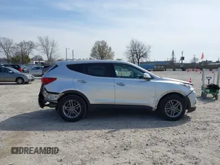2017 Hyundai Santa Fe 2.4L z VIN 5XYZTDLB8HG465425, wystawiony jako IAAI lot #42041881 z przebiegiem 103 161 mil mil oraz . Historia ofert i sprzedaży dostępna na DreamBid. Obrazek 13.