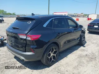 2021 Ford Escape SE z VIN 1FMCU0G66MUB26983, wystawiony jako IAAI lot #42144053 z przebiegiem 60 614 mil mil oraz . Historia ofert i sprzedaży dostępna na DreamBid. Obrazek 4.