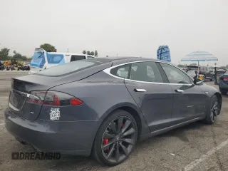 2014 Tesla Model S 60 with VIN 5YJSA1H10EFP60690, listed as a Copart auction lot 62515065 with 57,864 mi miles and Clean title. Bid and sale history available at DreamBid. Image 3.