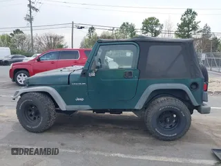2000 Jeep Wrangler SE with VIN 1J4FA29P0YP728370, listed as a IAAI auction lot 41788463 with 186,995 mi miles. Bid and sale history available at carsss.com. Image 14.
