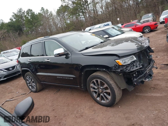 2017 Jeep Grand Cherokee Overland z VIN 1C4RJECG4HC878258, wystawiony jako IAAI lot #41361352 z przebiegiem 137 574 mil mil oraz . Historia ofert i sprzedaży dostępna na DreamBid. Obrazek 13.