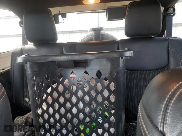 2015 Jeep Wrangler Unlimited Freedom with VIN 1C4BJWDG4FL568601, listed as a Copart auction lot 64041415 with 128,874 mi miles and Salvage title. Bid and sale history available at DreamBid. Image 10.