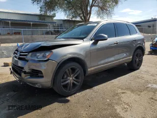 2013 Volkswagen Touareg Sport с VIN WVGEP9BP0DD010408, выставлен на аукционе Copart как лот 75854084 с пробегом 159 863 миль миль и Списание • Salvage title. История ставок и продаж доступна на DreamBid. Изображение 1.