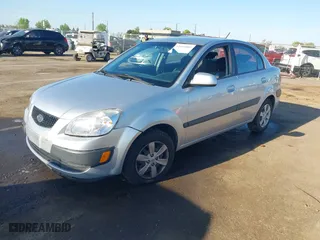 2009 Kia Rio SX with VIN KNADE223296523842, listed as a IAAI auction lot 42024905 with 98,613 mi miles. Bid and sale history available at carsss.com. Image 2.