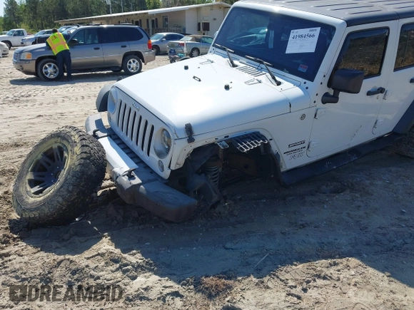 2015 Jeep Wrangler Unlimited Willys Wheeler with VIN 1C4BJWDG0FL546000, listed as a IAAI auction lot 41984566 with 112,742 mi miles and . Bid and sale history available at DreamBid. Image 6.