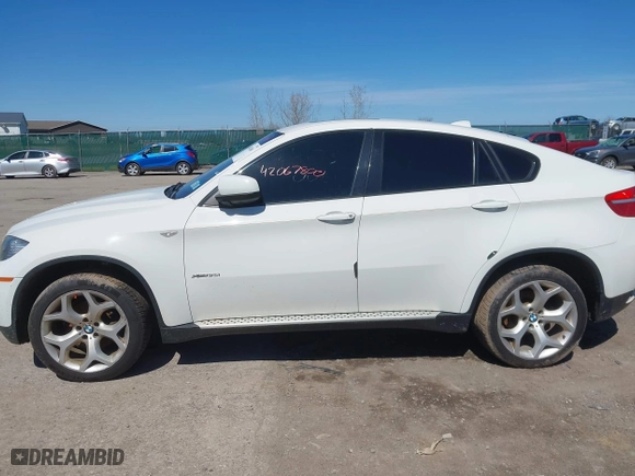 2011 BMW X6 35i with VIN 5UXFG2C58BLX07890, listed as a IAAI auction lot 42067800 with 144,367 mi miles. Bid and sale history available at carsss.com. Image 14.
