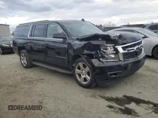 2019 Chevrolet Suburban LT with VIN 1GNSCHKC8KR127431, listed as a Copart auction lot 43931515 with 123,338 mi miles and Salvage Title. Bid and sale history available at DreamBid. Image 4.