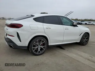 2021 BMW X6 M50i with VIN 5UXCY8C04M9D98395, listed as a Copart auction lot 85536134 with 57,891 mi miles and Salvage Title. Bid and sale history available at carsss.com. Image 3.