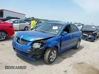 2008 Kia Rio LX with VIN KNADE123886374992, listed as a IAAI auction lot 42027536 with 129,916 mi miles and . Bid and sale history available at DreamBid. Image 2.