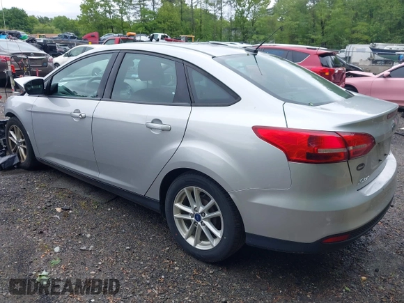 2016 Ford Focus SE z VIN 1FADP3F29GL353908, wystawiony jako IAAI lot #42289308 z przebiegiem 94 937 mil mil oraz . Historia ofert i sprzedaży dostępna na DreamBid. Obrazek 3.