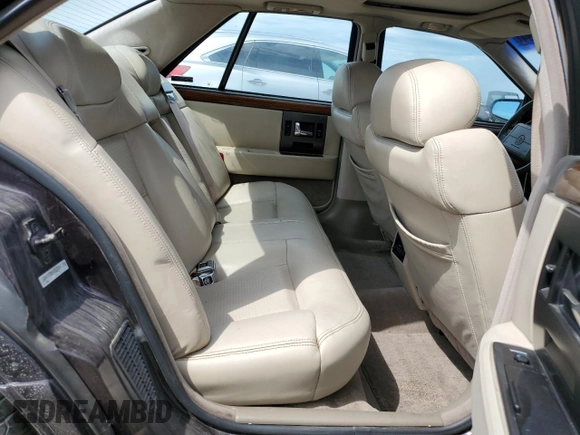 1992 Cadillac Seville z VIN 1G6KY53BXNU804126, wystawiony jako Copart lot #69219394 z przebiegiem 100 647 mil mil oraz Czysty tytuł • Clean title. Historia ofert i sprzedaży dostępna na DreamBid. Obrazek 10.