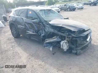 2018 Mazda CX-5 Grand Touring z VIN JM3KFADM5J1365772, wystawiony jako IAAI lot #42251805 z przebiegiem 44 599 mil mil oraz . Historia ofert i sprzedaży dostępna na DreamBid. Obrazek 1.