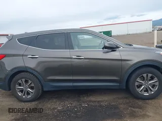 2014 Hyundai Santa Fe z VIN 5XYZTDLB1EG144290, wystawiony jako IAAI lot #42126367 z przebiegiem 138 525 mil mil oraz . Historia ofert i sprzedaży dostępna na DreamBid. Obrazek 13.