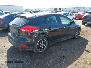 2015 Ford Focus SE with VIN 1FADP3K26FL320689, listed as a IAAI auction lot 42160904 with 95,136 mi miles and . Bid and sale history available at DreamBid. Image 4.