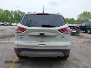 2016 Ford Escape SE with VIN 1FMCU9GX1GUC04085, listed as a IAAI auction lot 42126826 with 130,728 mi miles. Bid and sale history available at carsss.com. Image 16.