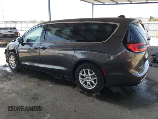 2023 Chrysler Pacifica Touring L with VIN 2C4RC1BG1PR581376, listed as a Copart auction lot 59901915 with 57,411 mi miles and Salvage title. Bid and sale history available at DreamBid. Image 2.