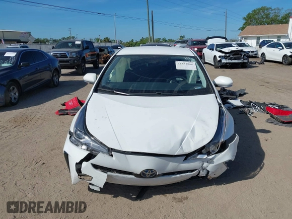 2021 Toyota Prius L Eco with VIN JTDKAMFU2M3147562, listed as a IAAI auction lot 41882066 with 99,491 mi miles. Bid and sale history available at carsss.com. Image 12.