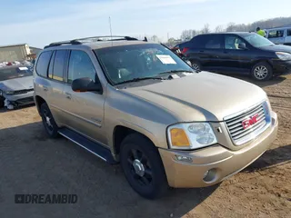2006 GMC Envoy SLT with VIN 1GKDT13S162232037, listed as a IAAI auction lot 42068042 with 170,669 mi miles and . Bid and sale history available at DreamBid. Image 1.