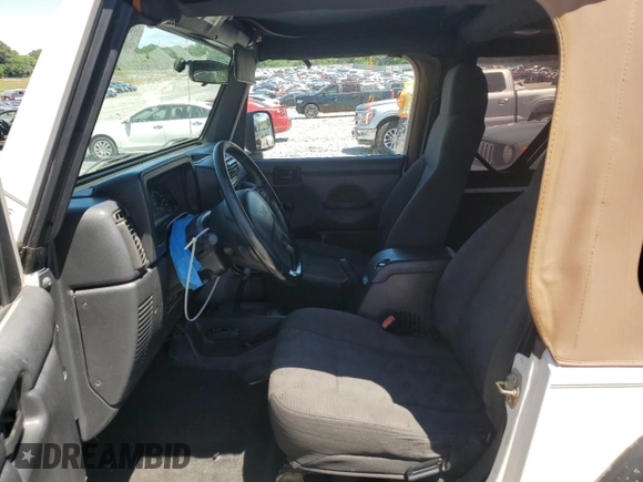 2004 Jeep Wrangler Sport with VIN 1J4FA49S94P751849, listed as a Copart auction lot 55519445 with 139,854 mi miles and Salvage title. Bid and sale history available at DreamBid. Image 7.
