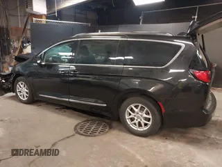 2020 Chrysler Pacifica Touring L with VIN 2C4RC1BG2LR280156, listed as a IAAI auction lot 42182406 with 105,038 mi miles and . Bid and sale history available at DreamBid. Image 3.