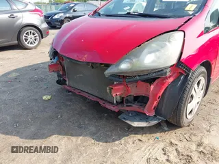 2009 Honda Fit z VIN JHMGE88219S023503, wystawiony jako IAAI lot #42376165 z przebiegiem 142 166 mil mil oraz . Historia ofert i sprzedaży dostępna na DreamBid. Obrazek 6.