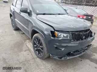 2018 Jeep Grand Cherokee Laredo E with VIN 1C4RJFAG0JC267822, listed as a IAAI auction lot 40876905 with 136,491 mi miles. Bid and sale history available at carsss.com. Image 1.