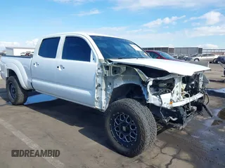 2014 Toyota Tacoma with VIN 3TMMU4FN9EM062808, listed as a IAAI auction lot 41450058 with 192,628 mi miles and . Bid and sale history available at DreamBid. Image 6.