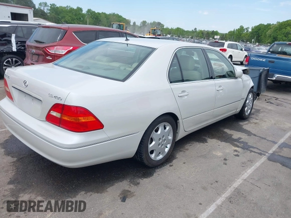2001 Lexus LS 430 with VIN JTHBN30F110026221, listed as a IAAI auction lot 42022976 with 142,418 mi miles. Bid and sale history available at carsss.com. Image 4.