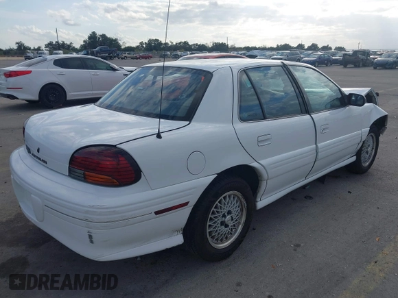 1997 Pontiac Grand Am SE with VIN 1G2NE52T3VC809661, listed as a IAAI auction lot 41100711 with 168,686 mi miles and . Bid and sale history available at DreamBid. Image 4.