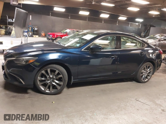 2017 Mazda 6 Grand Touring with VIN JM1GL1W51H1101519, listed as a IAAI auction lot 42132215 with 145,796 mi miles. Bid and sale history available at carsss.com. Image 14.