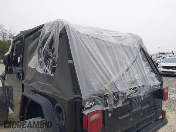 2003 Jeep Wrangler X with VIN 1J4FA39S33P375741, listed as a IAAI auction lot 40858427 with Not provided miles and . Bid and sale history available at DreamBid. Image 6.