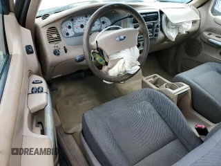 2002 Ford Explorer Sport Value with VIN 1FMYU60EX2UC31677, listed as a Copart auction lot 46415785 with 104,684 mi miles and Salvage title. Bid and sale history available at DreamBid. Image 8.