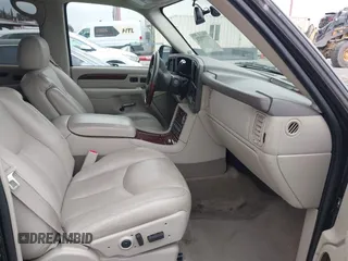 2005 Cadillac Escalade z VIN 1GYEC63T95R181022, wystawiony jako IAAI lot #41777173 z przebiegiem 44 348 mil mil oraz . Historia ofert i sprzedaży dostępna na DreamBid. Obrazek 5.