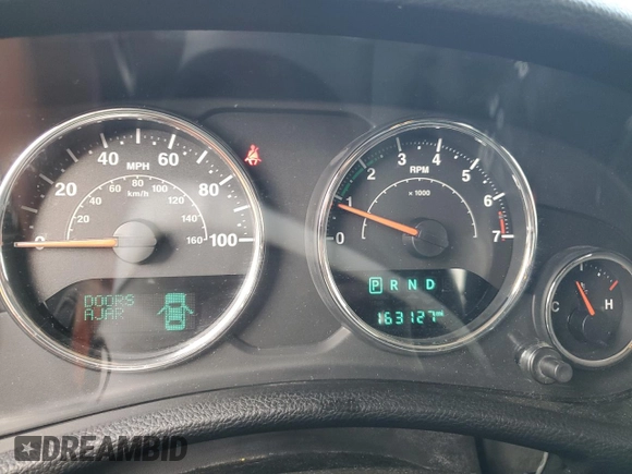 2014 Jeep Wrangler Unlimited Sport with VIN 1C4BJWDG6EL320381, listed as a Copart auction lot 51051704 with 163,127 mi miles and Salvage Title. Bid and sale history available at carsss.com. Image 9.
